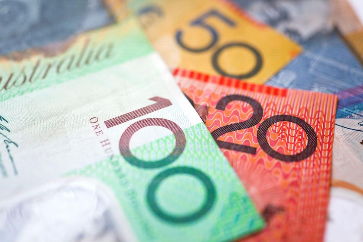 Australian banknotes fanned out — the growing cash prize pool of a 50/50 raffle