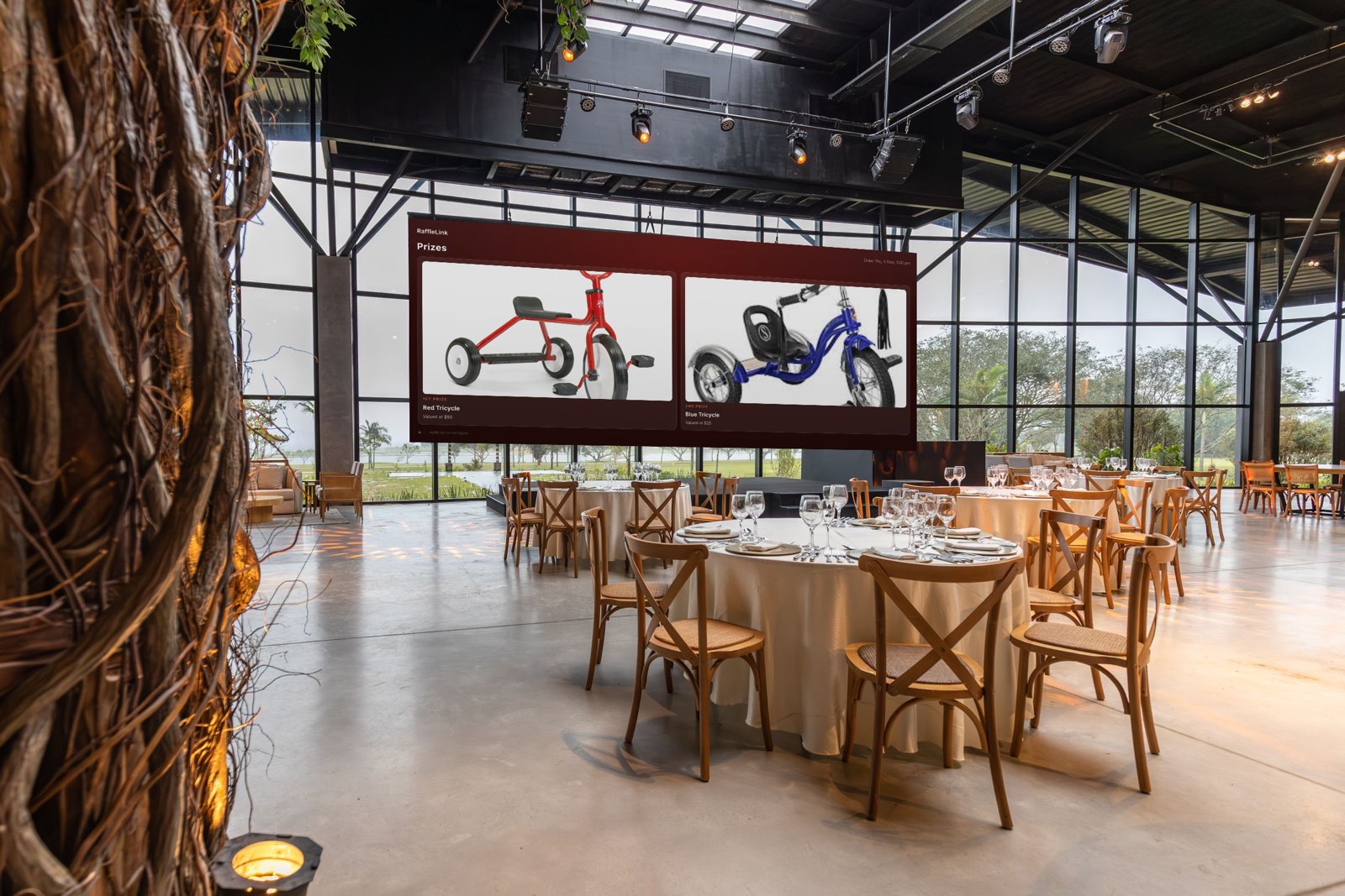 A function room set for dinner, with round tables and timber chairs, and the RaffleLink event screen on a large wall display above them showing the raffle's prizes